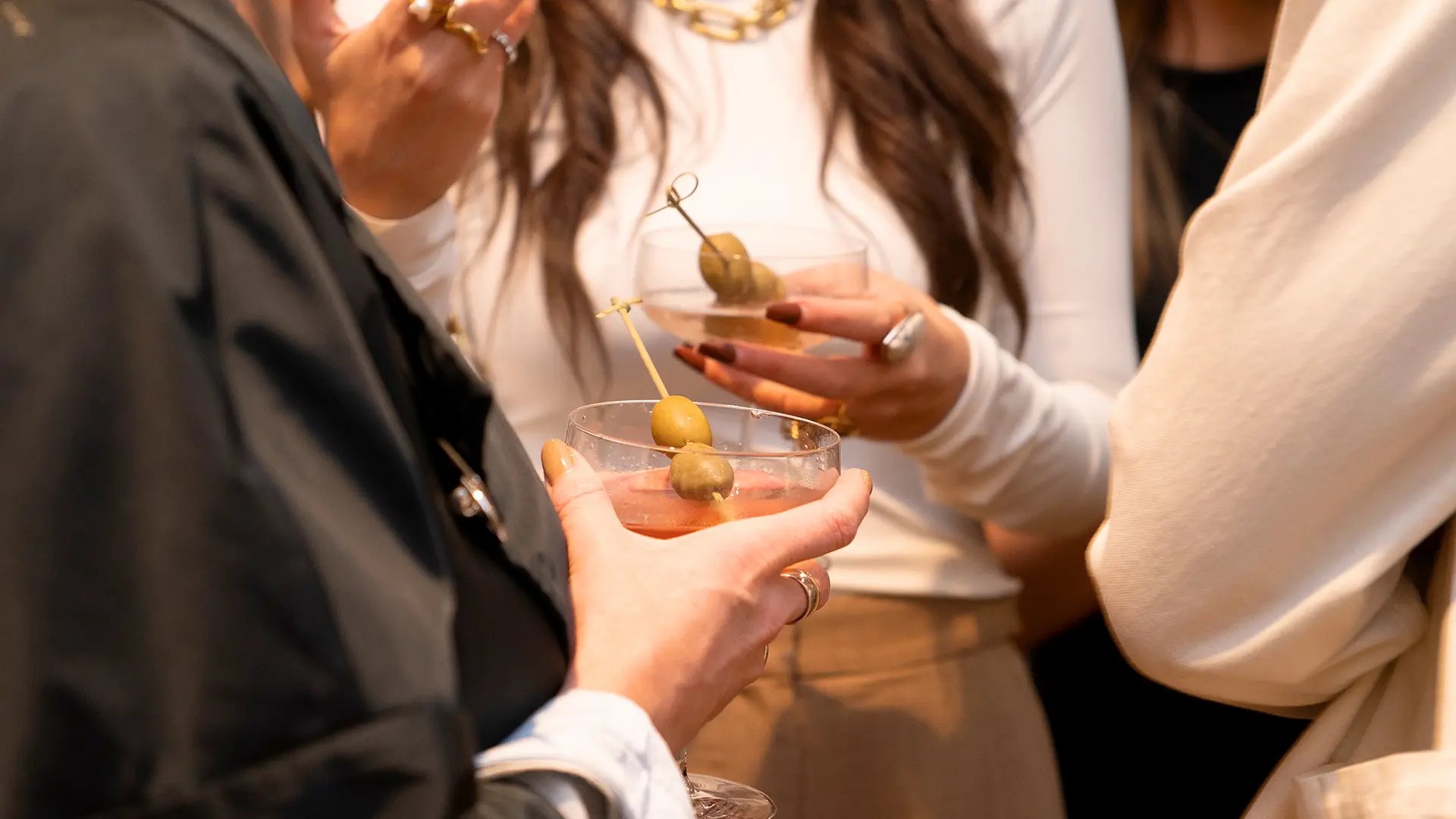 Drinking a cocktail at a function